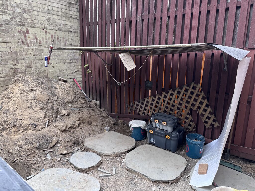 A clothesline turned into a makeshift shelter