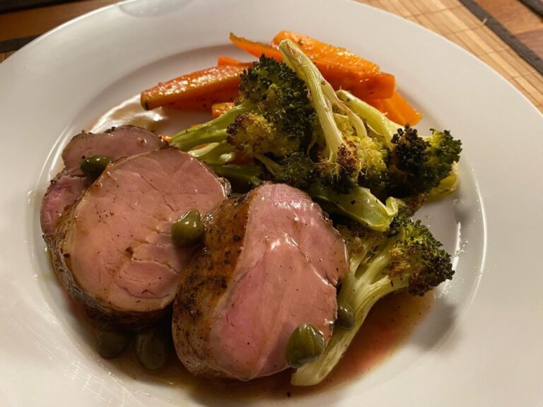 Dinner tonight: sous vide pork loin with white wine caper sauce (made by Rodd), with roasted broccoli and honey glazed carrots (made by me).