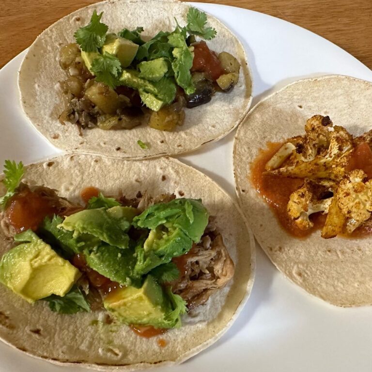 A trio of tacos from the Snook! Roast cauliflower with romesco sauce, slow cooker pulled pork, and barbacoa eggplant. 🌮 🌮🌮