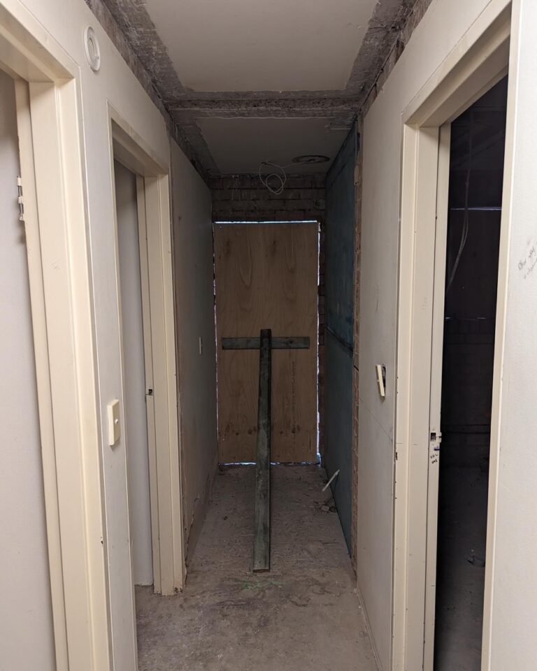 Week 3: Two of the new walls are built, and plumbing and electrical have been chased in. Our bathroom is finally a rectangle! The internet has been moved to a more practical location, and we can start to see what the back entrance hallway will look like. Next up is to fix the very uneven floor before plastering can begin… 🏠🚧