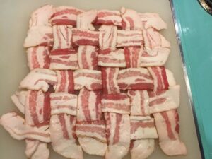 Step 5 (and this is where I start marvelling at the work he put into this): weave a POUND of bacon into a lattice. 😂 https://t.co/2KNDWpKK29