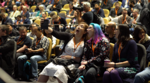 LOL - I'm watching an internal sneak preview of the #awscommunityday recap video, and the camera caught the moment @minxdragon and I took our selfie! 💜 (Full video will be published soon, I'm told.) https://t.co/hiie4bYJHl