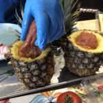 Step 3: stuff the marinated pork tenderloin into the pineapple. (Technically this is Step 4, but we got overexcited to see if it would fit.) #swineapple 🐷🍍 https://t.co/vzG0IBIudc