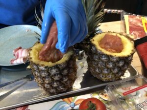 Step 3: stuff the marinated pork tenderloin into the pineapple. (Technically this is Step 4, but we got overexcited to see if it would fit.) #swineapple 🐷🍍 https://t.co/vzG0IBIudc