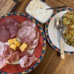 Lunchtime virtual class on Albanian cooking with Deshira, a wonderful chef from @migratefuluk! Vegetarian courgette fritters... which I paired with a plate of German cold cuts. 😍😂 https://t.co/6vWKzv9tpd