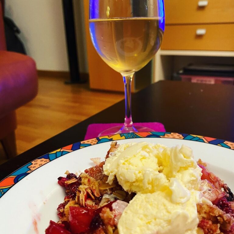 I took care of dessert. Apple and berry crisp with vanilla ice cream, served with a glass of bubbly. Happy NYE! 🥂