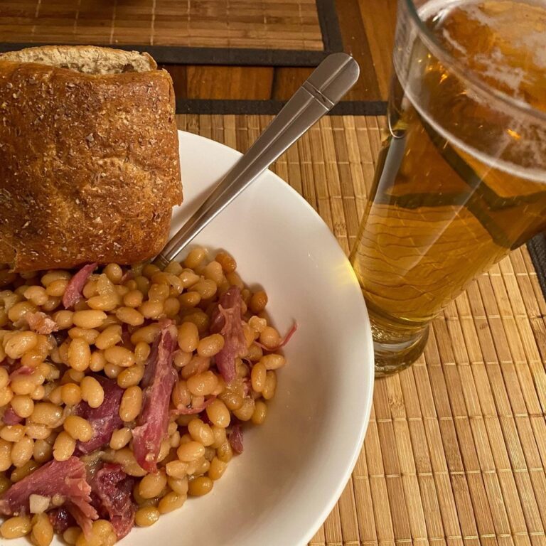 My night to cook dinner: Maple-baked beans with smoked ham hock and bacon, served with dark bread and beer! 🍻