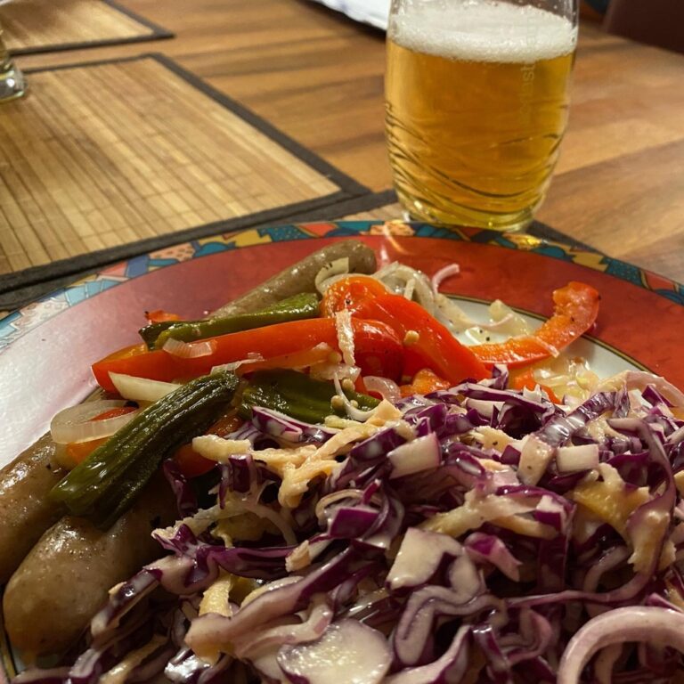 Beer-braised bratwurst and pickled peppers & onions, served with creamy red coleslaw. #dinnerbyme 🍻