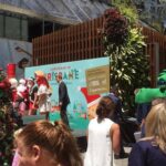 A dinosaur looks on while Santa kicks off the Christmas season in Brisbane. (Poor Santa must be sweating!) ☀️🎅😰 https://t.co/M4qp95SVtc https://t.co/rLIqfYPRiB