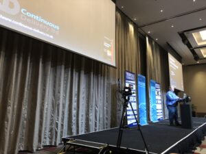 Watching as @davefarley77 awaits his intro for today's closing keynote... #yow17 https://t.co/m3sFaJvhN0