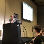 Loving @KenScambler's energy as he walks a large crowd through @REA_Group's FP journey. (Bonus points for the tiny @yow_conf t-shirt on the dev stick figure!) 👏💯 #Yow17 https://t.co/m7BX3QMpYv