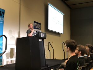 Loving @KenScambler's energy as he walks a large crowd through @REA_Group's FP journey. (Bonus points for the tiny @yow_conf t-shirt on the dev stick figure!) 👏💯 #Yow17 https://t.co/m7BX3QMpYv