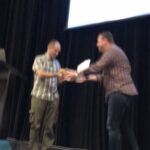 I'm not sure what just happened, but @delitescere just gave @jimwebber a baguette while introducing his talk on @neo4j. 😂 #yow17 https://t.co/Na6cThfOzU