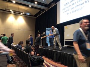 Audience participation as @WoodyZuill asks us for the ONE WORD that captures the essence of "an estimate." Post-Its everywhere! #yow17 #noestimates https://t.co/j3MlisyctF