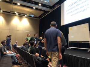 Audience participation as @WoodyZuill asks us for the ONE WORD that captures the essence of "an estimate." Post-Its everywhere! #yow17 #noestimates https://t.co/j3MlisyctF