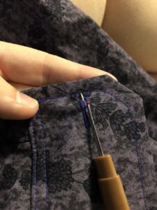 Step 24 - cut open buttonholes. https://t.co/MErdSMs52H