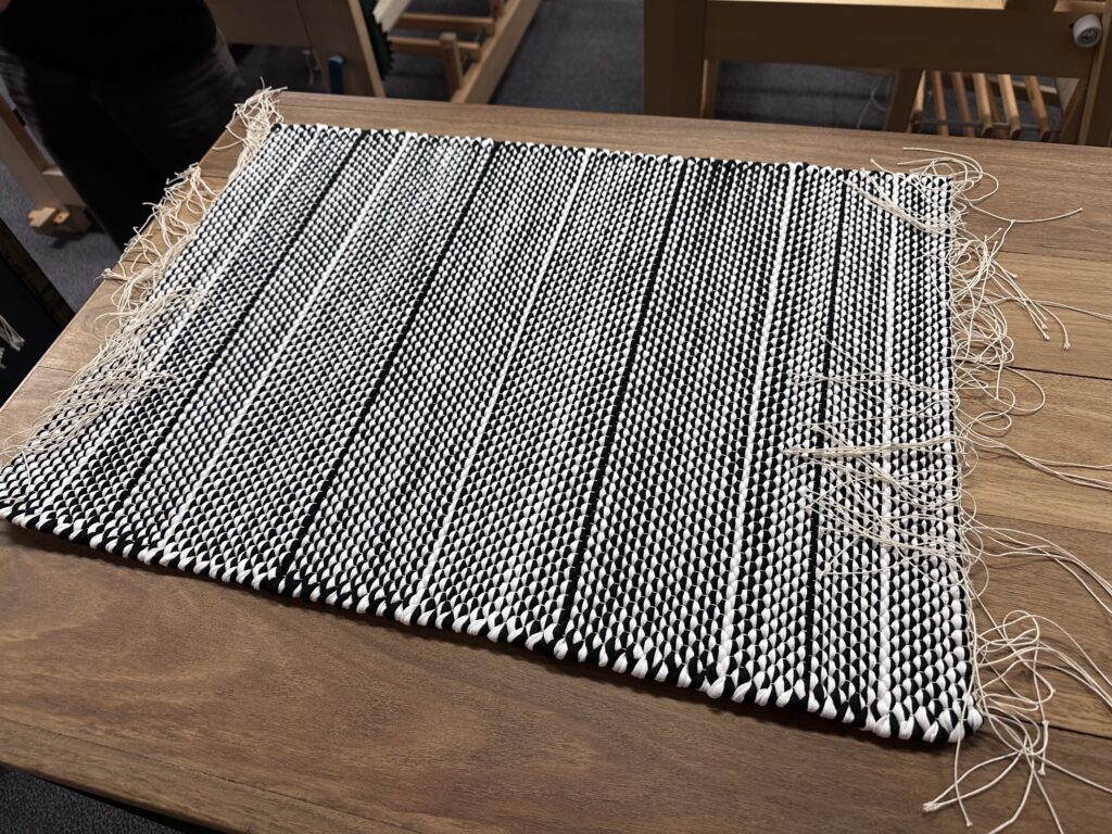 Rug with tied off warp threads