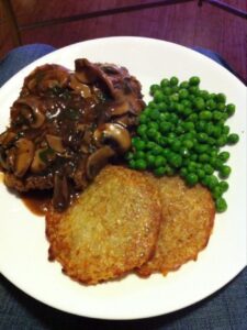 Homemade Jaeger Schnitzel with peas and (IKEA) rosti. Discovery: when I cook mushrooms, I actually like them!