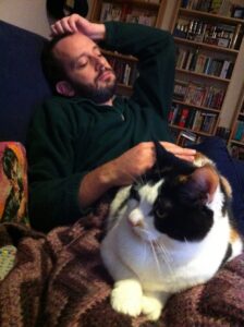 Dr Amy is administering Cat Reiki to Snookums. Such a good kitty.