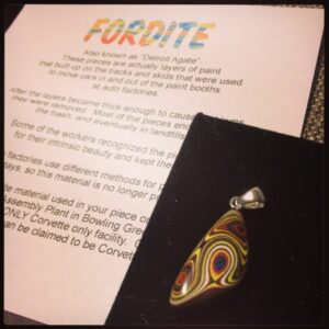 Yay! I finally have my very own piece of Corvette Fordite. Lovely metallic flecks. :)