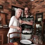 Making Aperol spritzes with his mother for a boozy lunch.