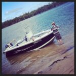 Mr Snook holds the Black Bass as we come ashore. Great day on the water!