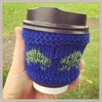 Knitted a tension swatch for @4colorcowboy's sweater and realised it's a perfect coffee cozy! #campjs